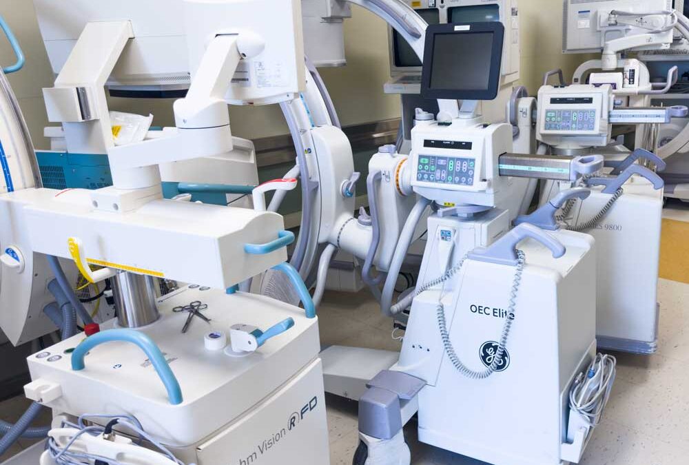 a room filled with several modern medical devices.